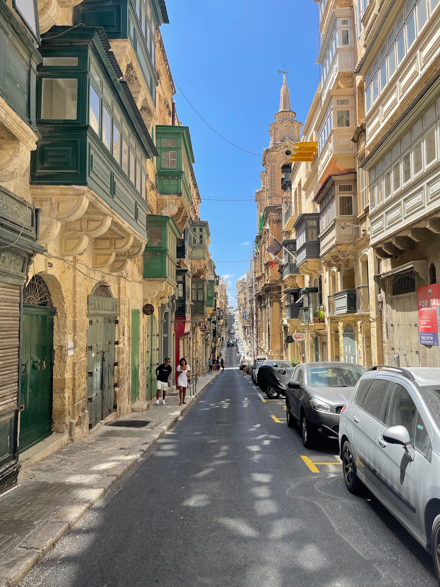 a street with cars and buildings