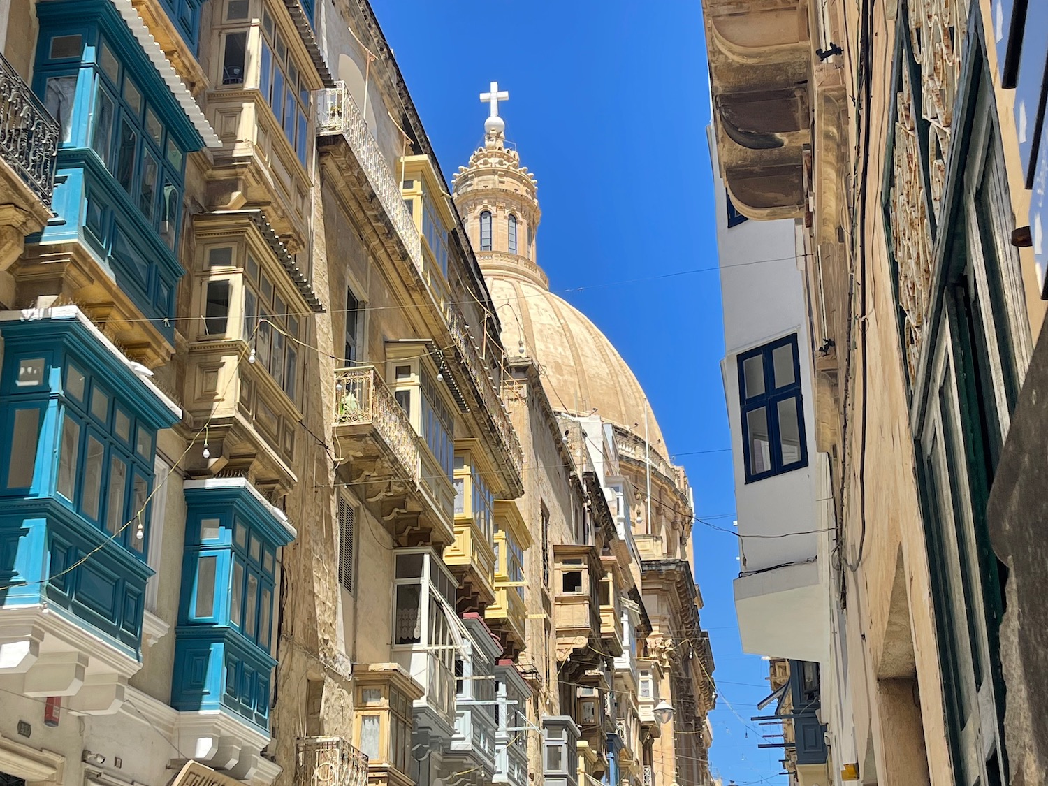 a street with buildings and a dome