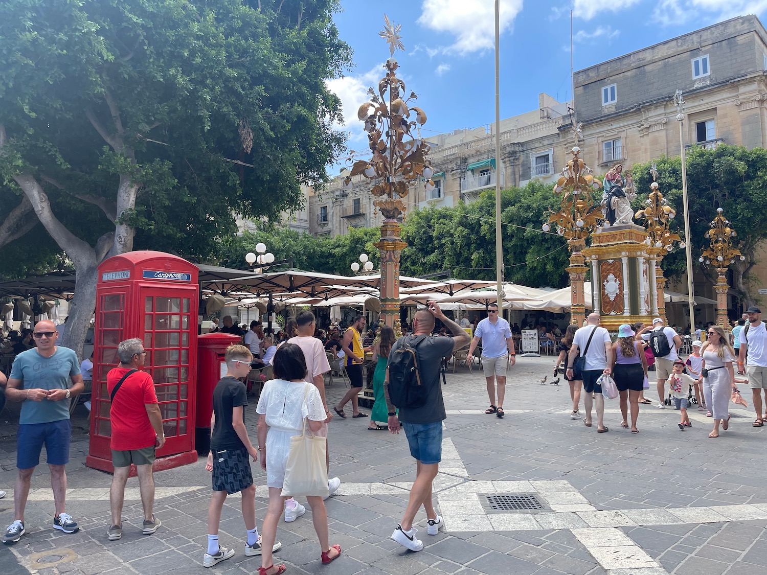 a group of people walking in a plaza