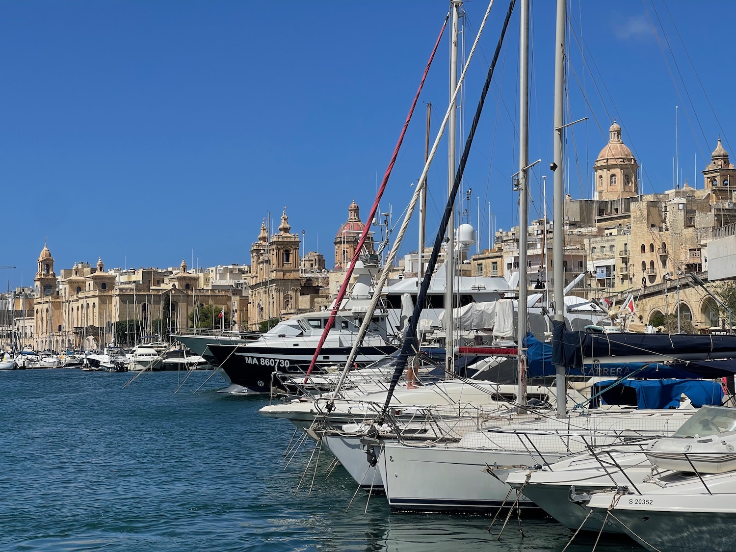 a group of boats in a harbor