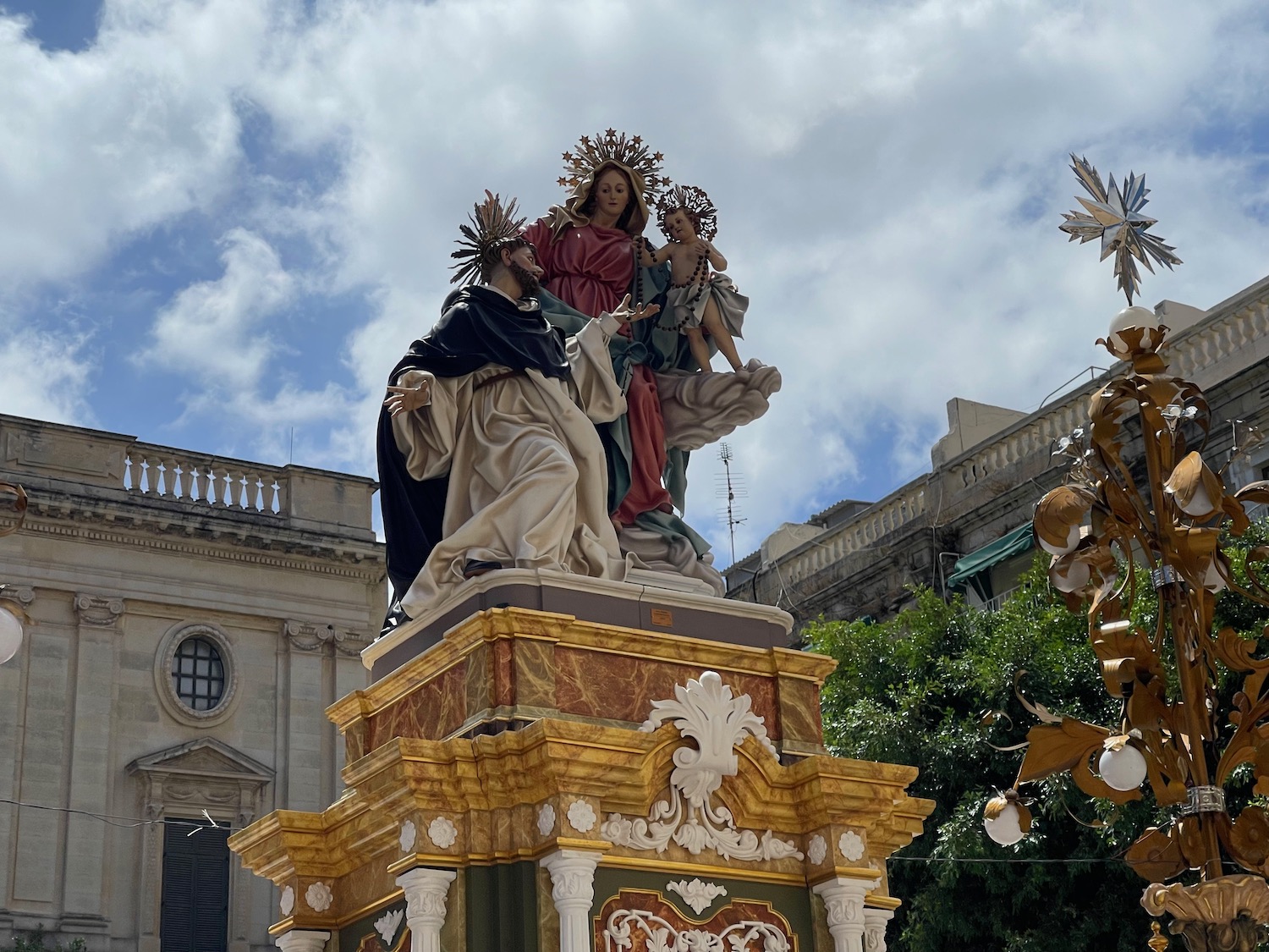 a statue of a woman holding a child