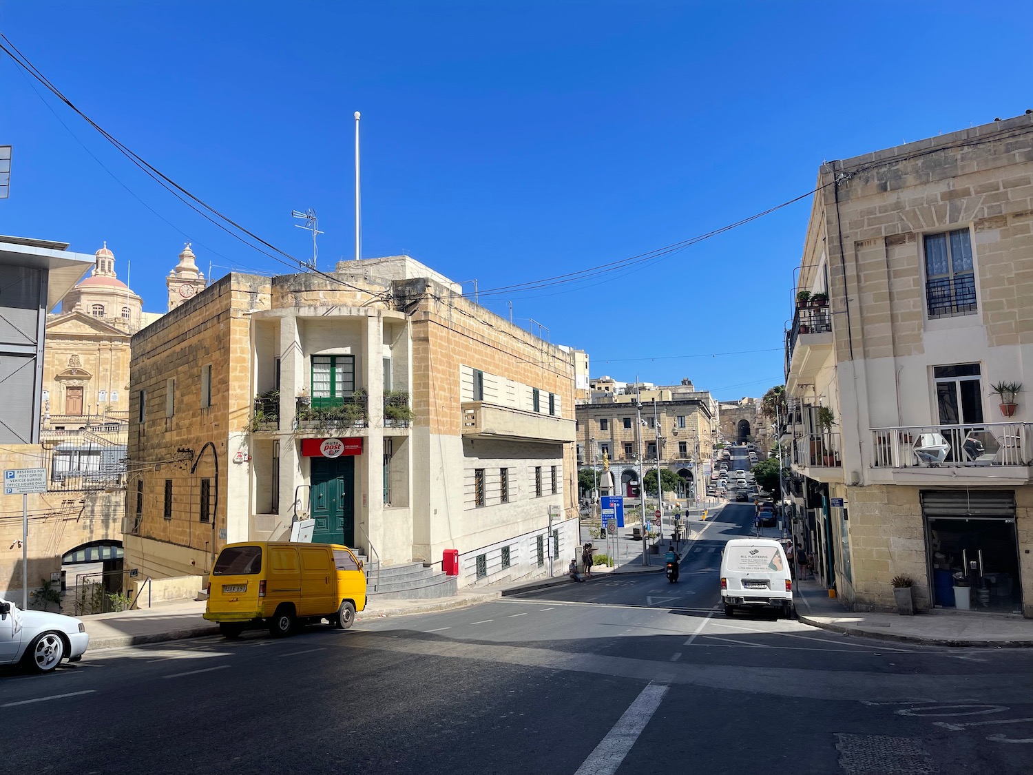 a street with buildings and cars on it