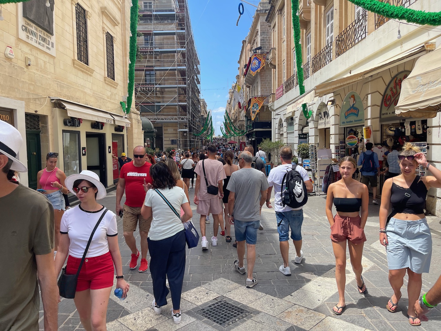 a group of people walking on a street