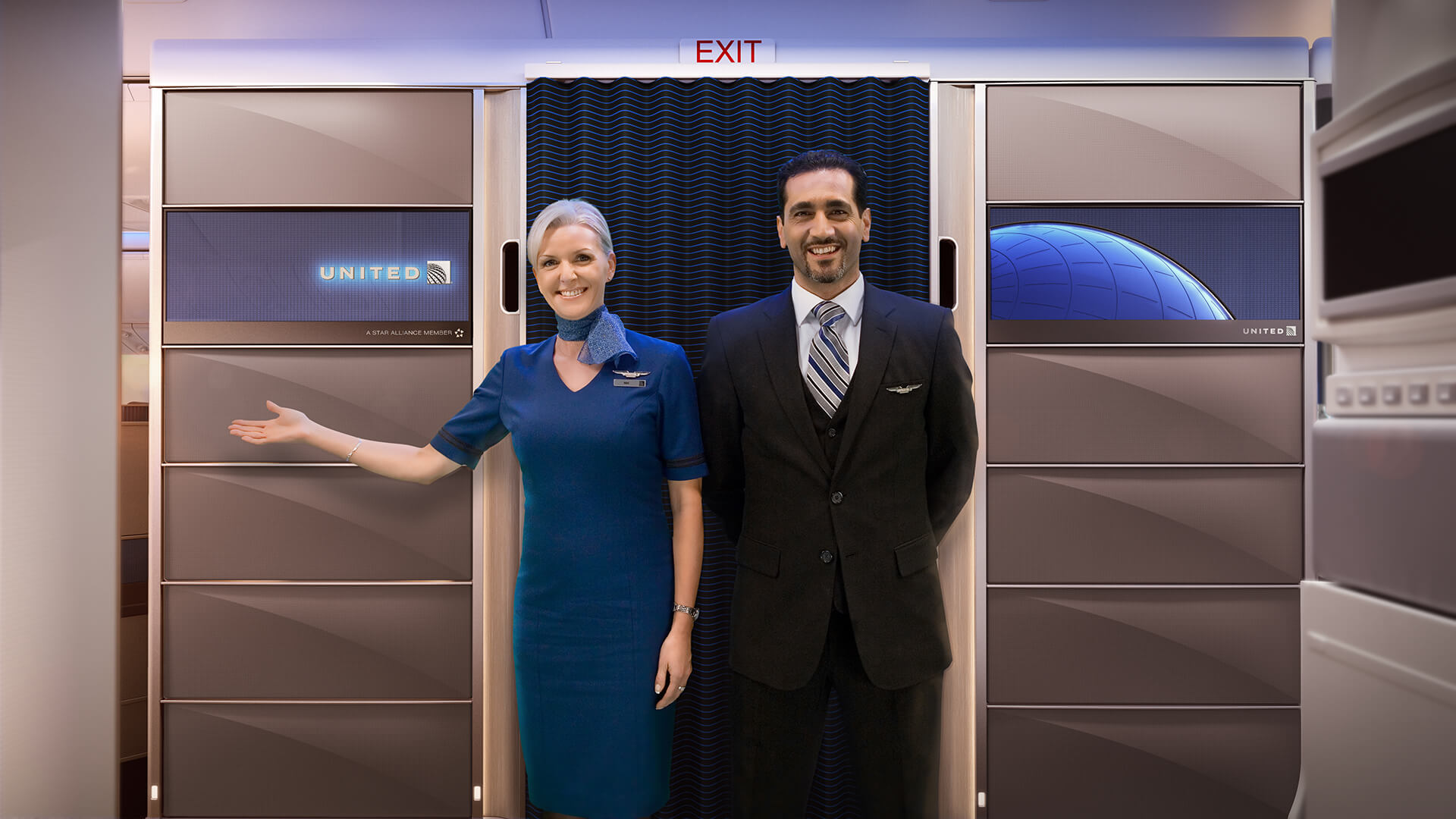 a man and woman standing in front of an exit door