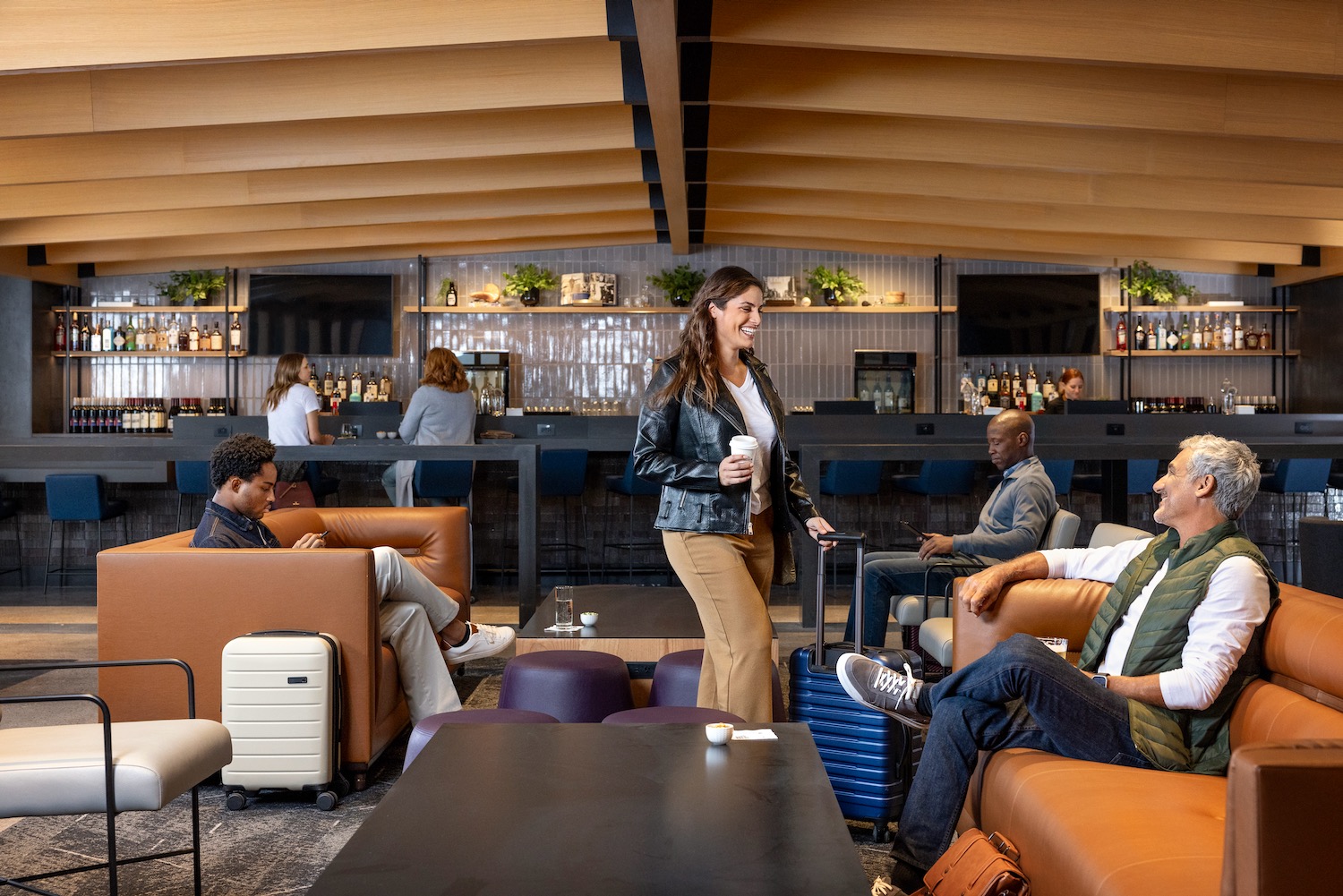 a group of people sitting in a lounge area