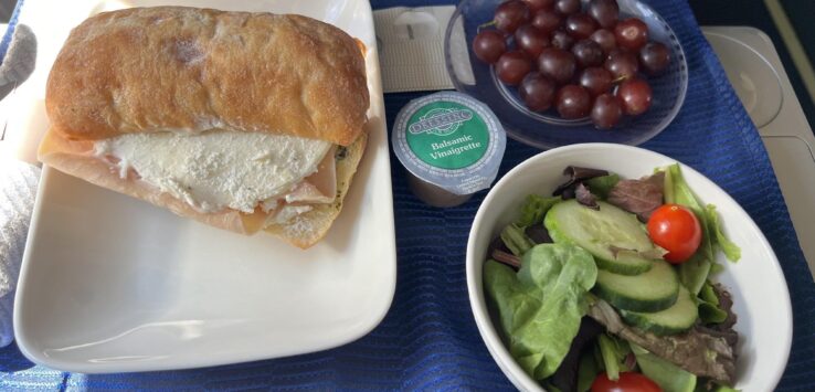 a plate of food and a bowl of salad