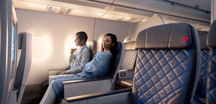 a man and woman sitting in a plane