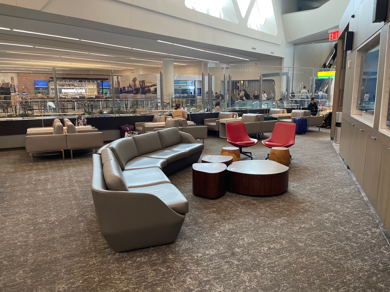 a large room with a large couch and tables