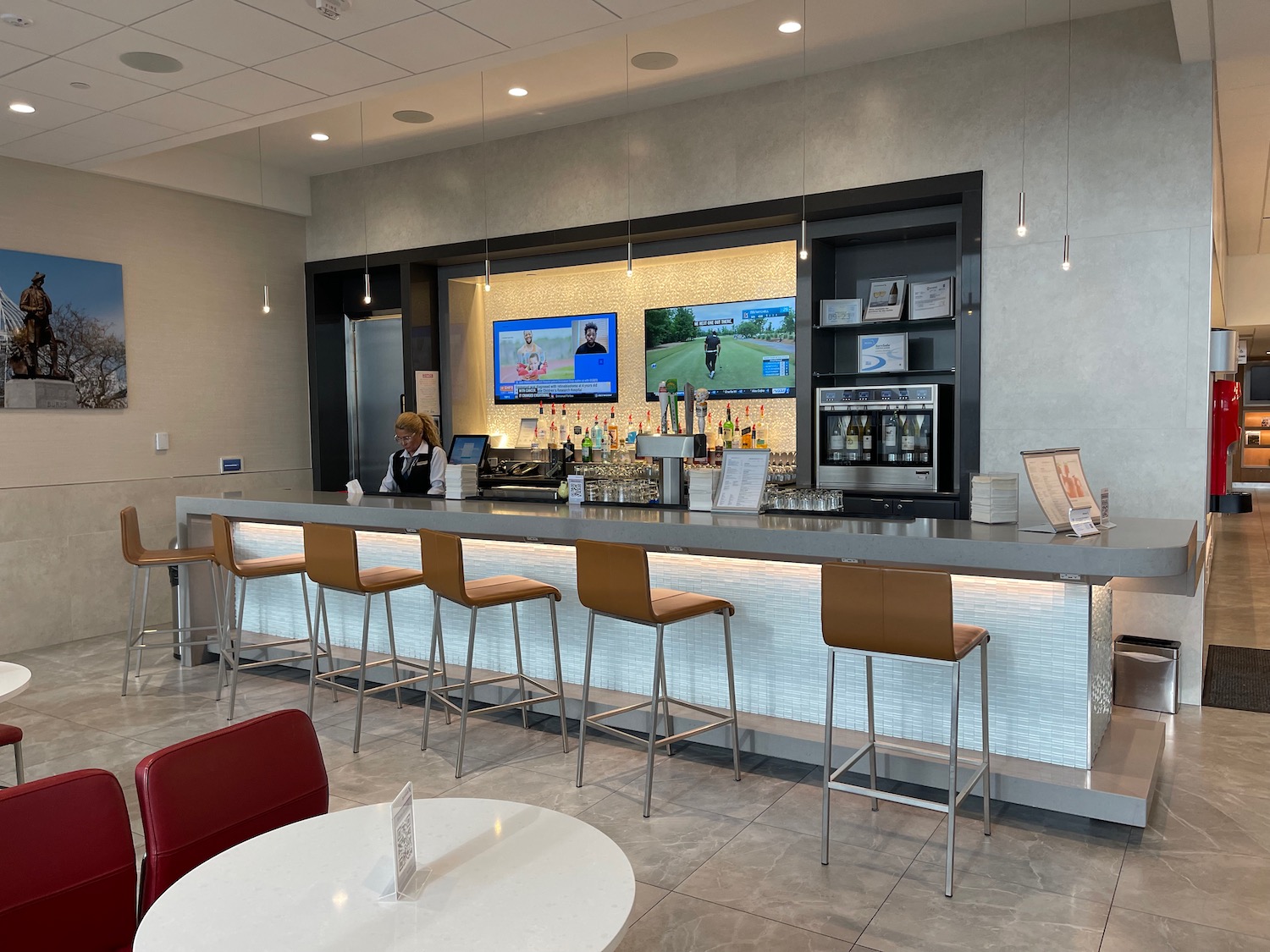 a bar with a counter and chairs