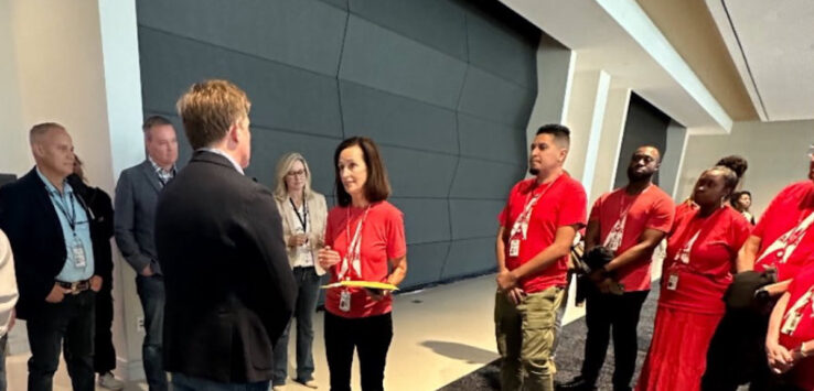 a group of people standing in a room