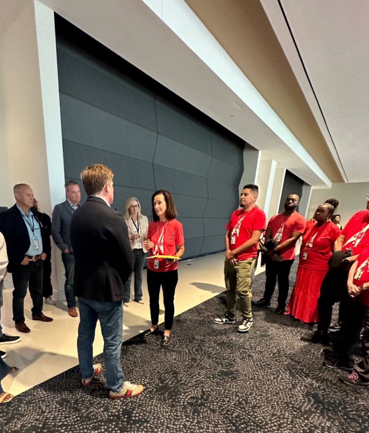 a group of people standing in a room