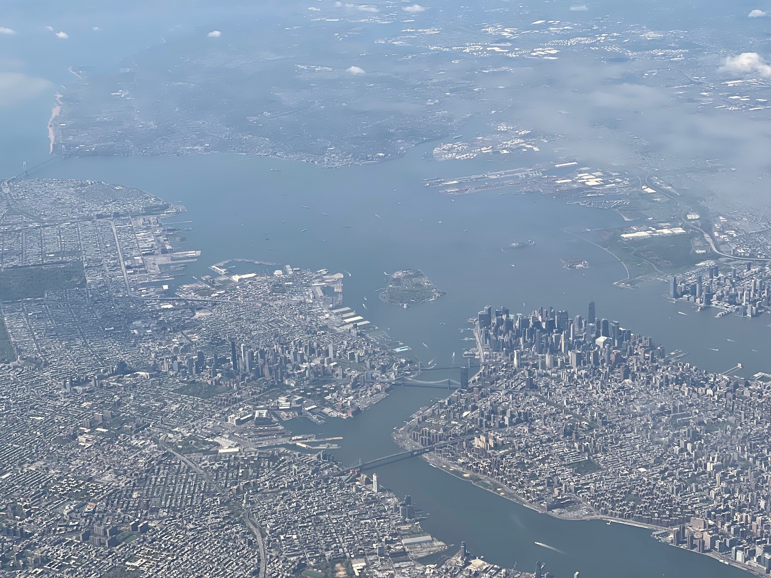 an aerial view of a city and water