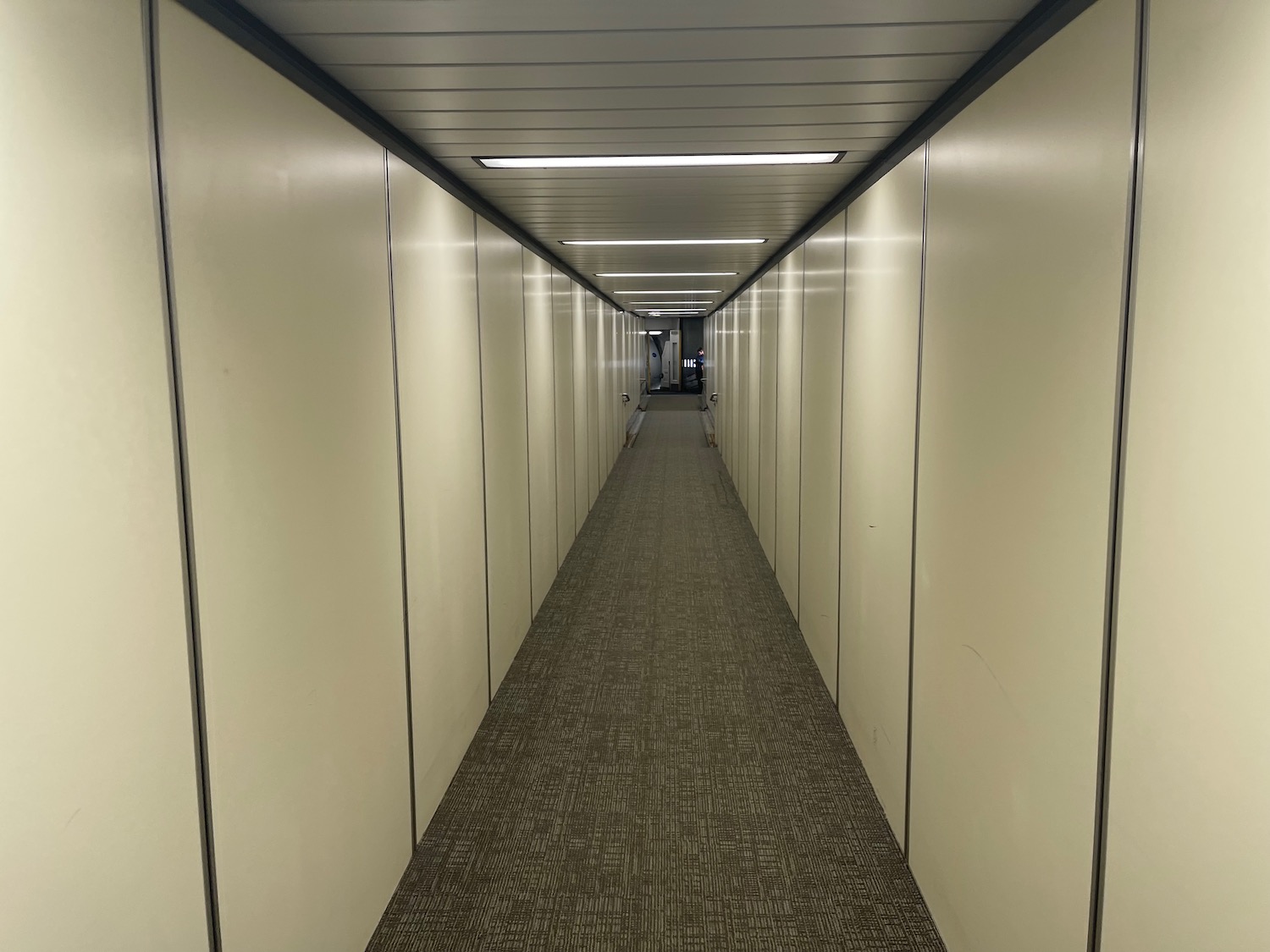 a long hallway with white walls