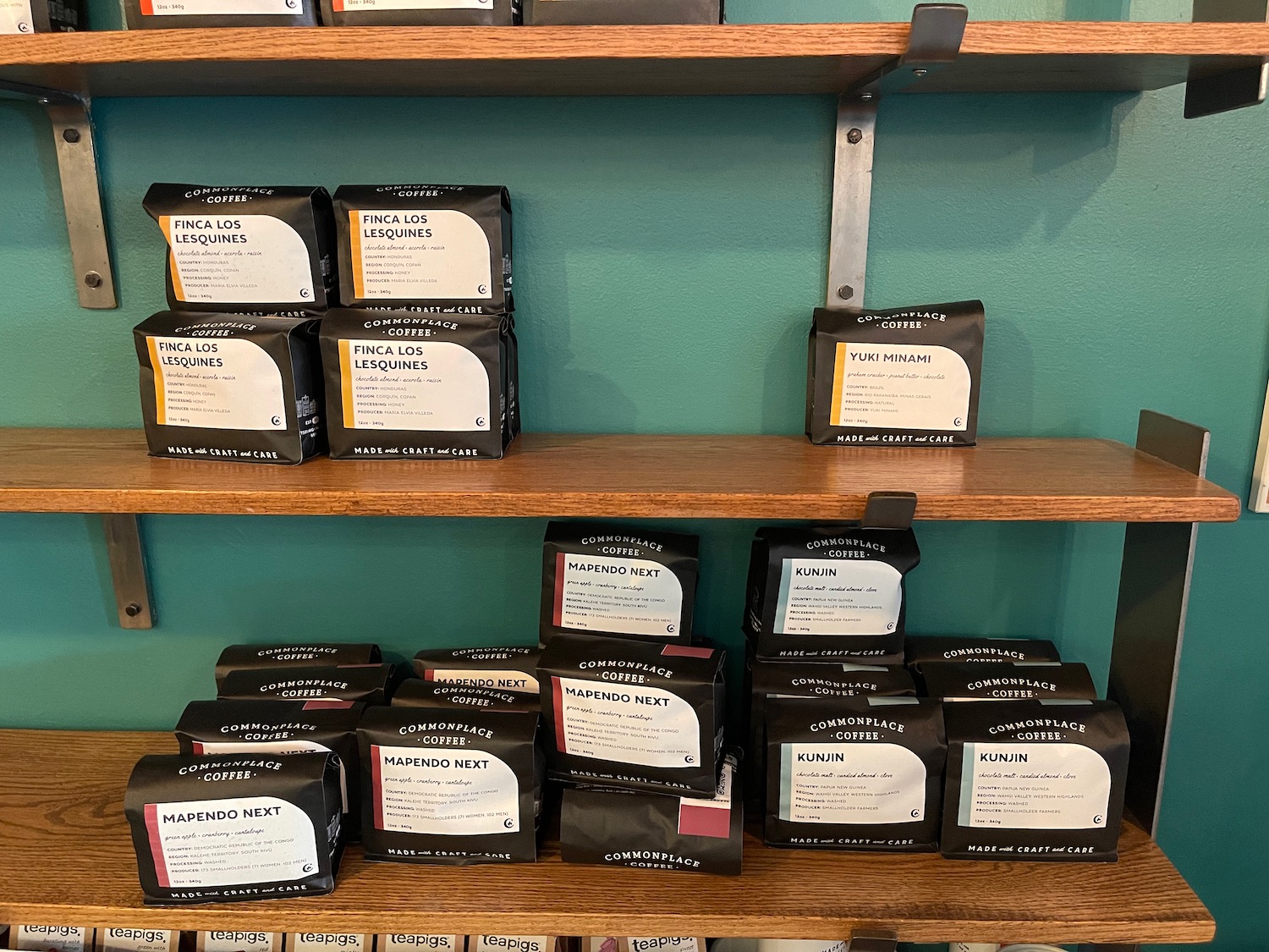 a shelf with black boxes on it