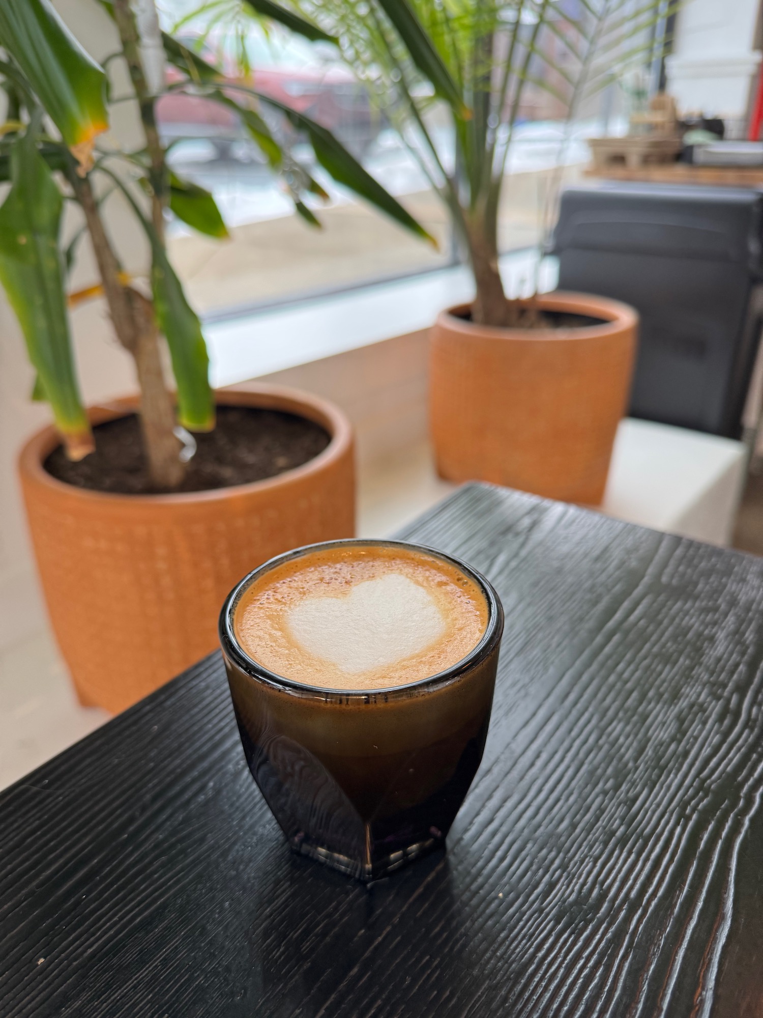 a cup of coffee with a heart on top of it