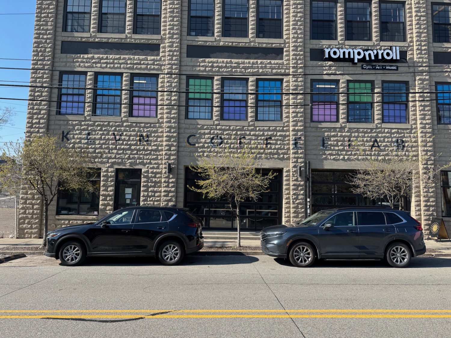 cars parked cars in front of a building