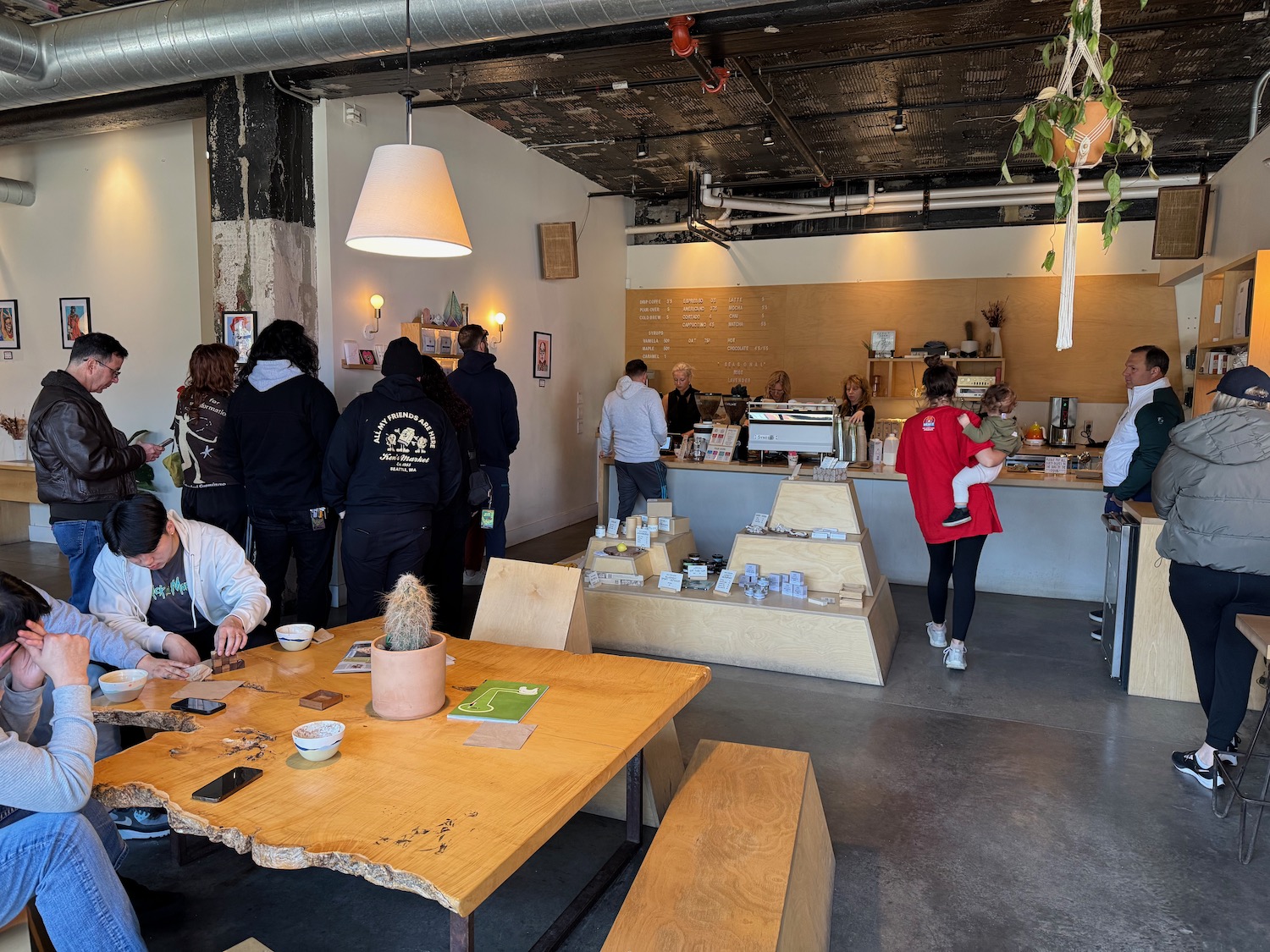 people in a room with tables and chairs