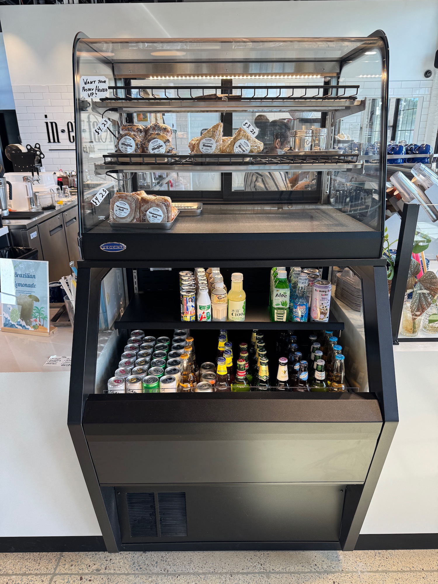 a display case with drinks and beverages