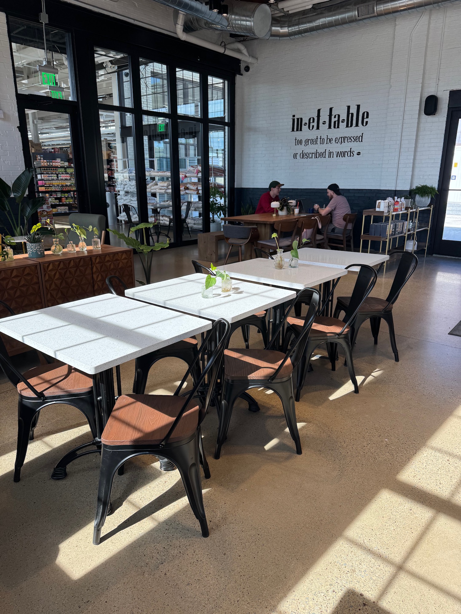 a group of tables and chairs in a room