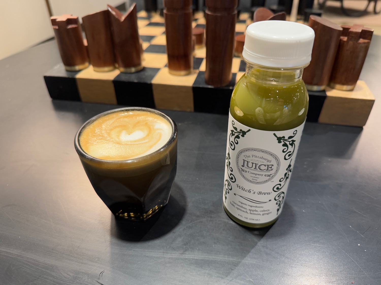 a drink and a bottle on a table
