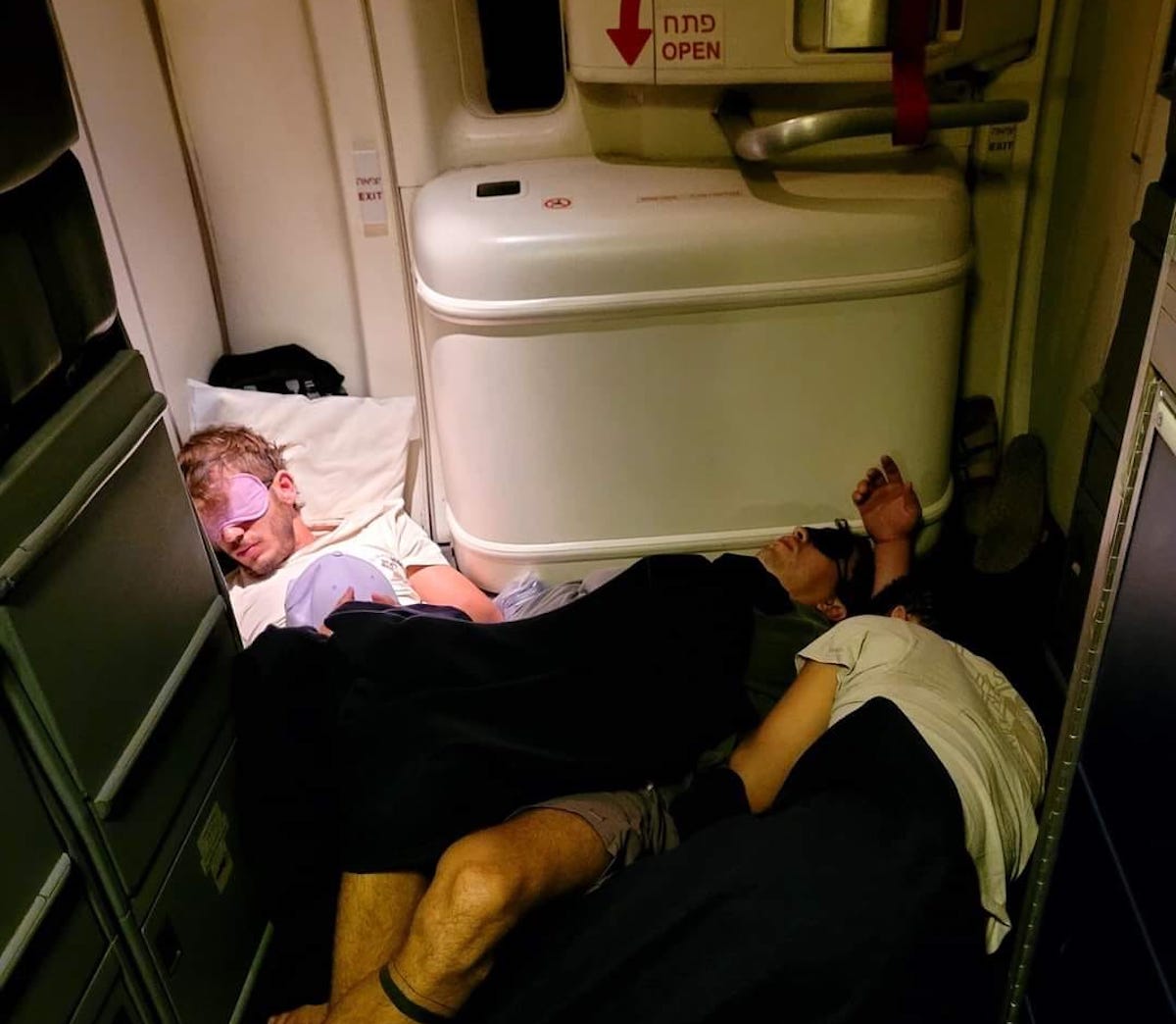 a man sleeping in a plane