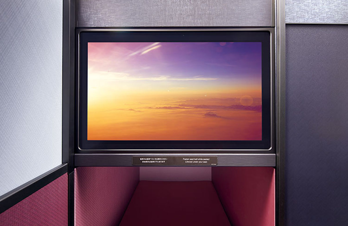 a screen with a sunset in the background