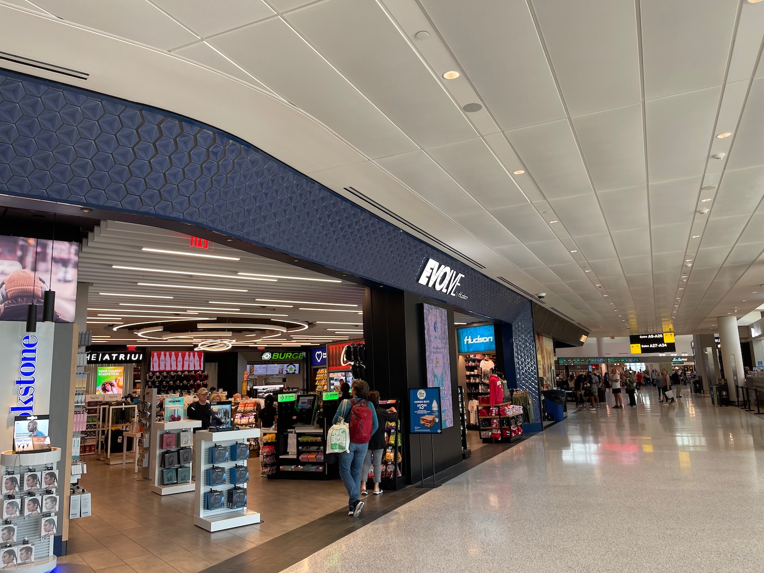 people walking in a large airport