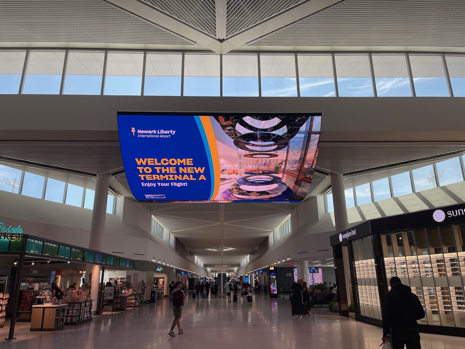 a large screen above a hallway