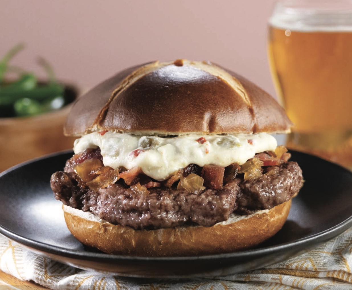 a burger with a glass of beer