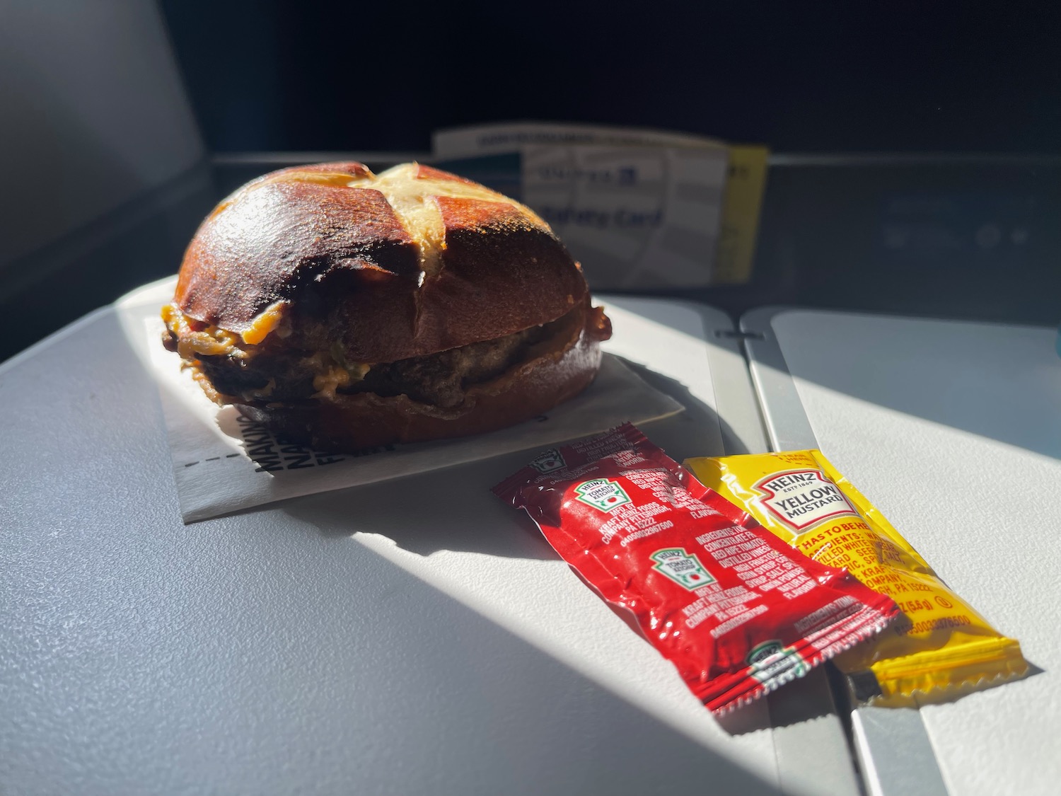 a hamburger and ketchup on a table