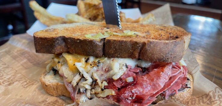 a sandwich with meat and cheese on a plate