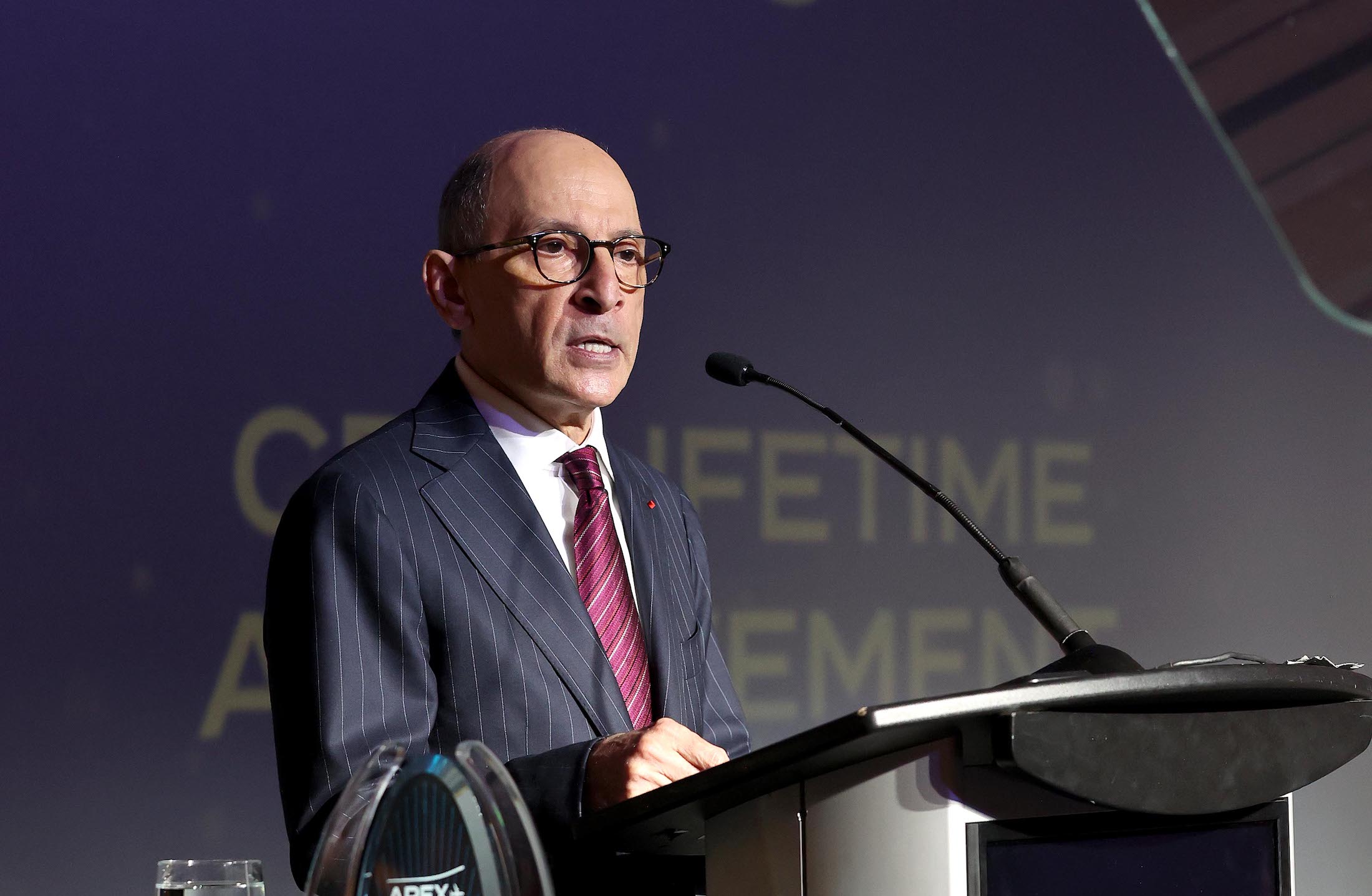 a man standing at a podium