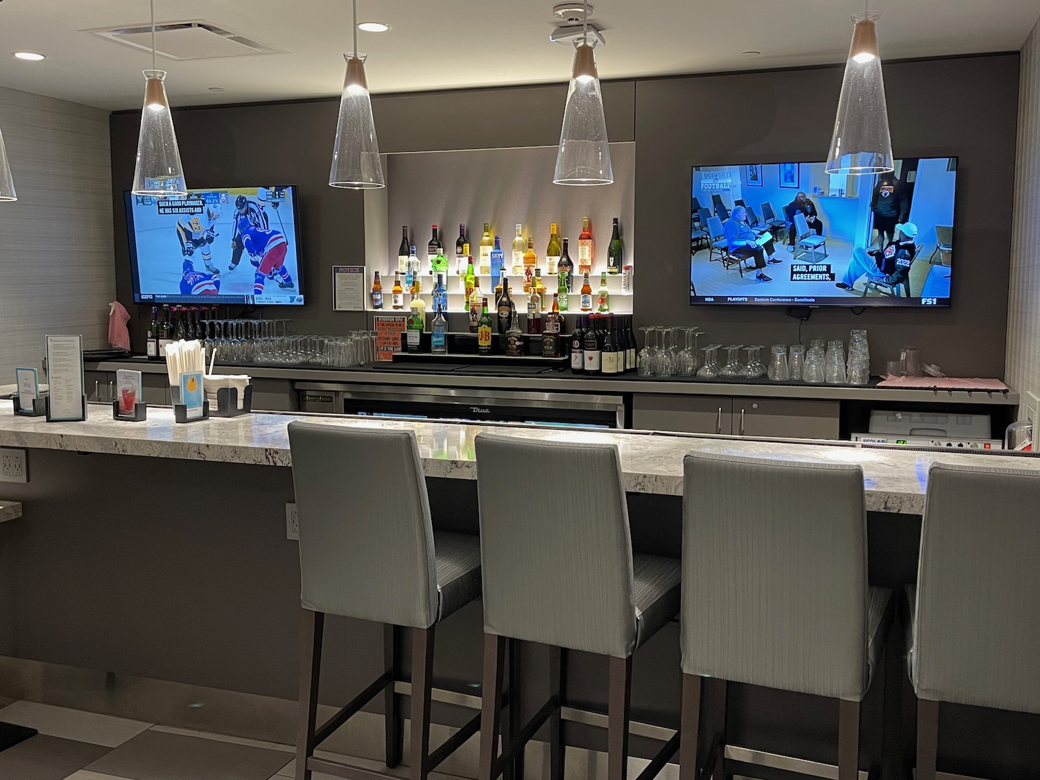 a bar with a bar and tvs