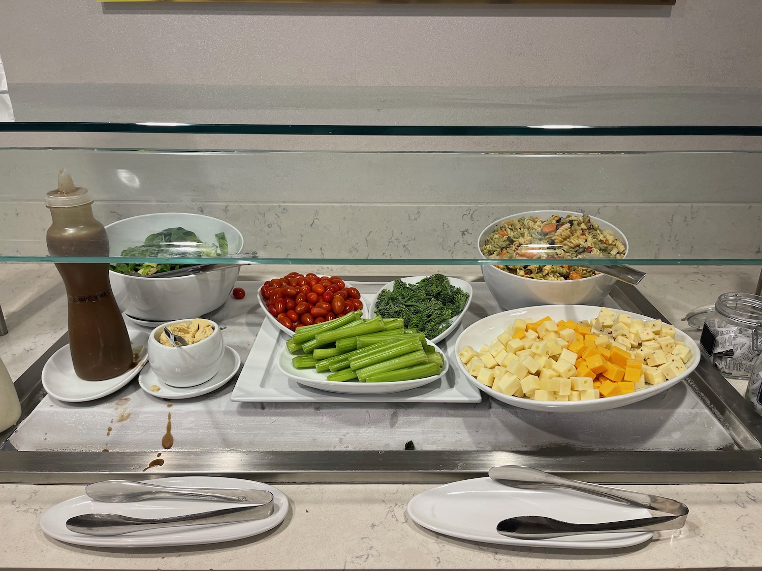 a buffet with different food items on it