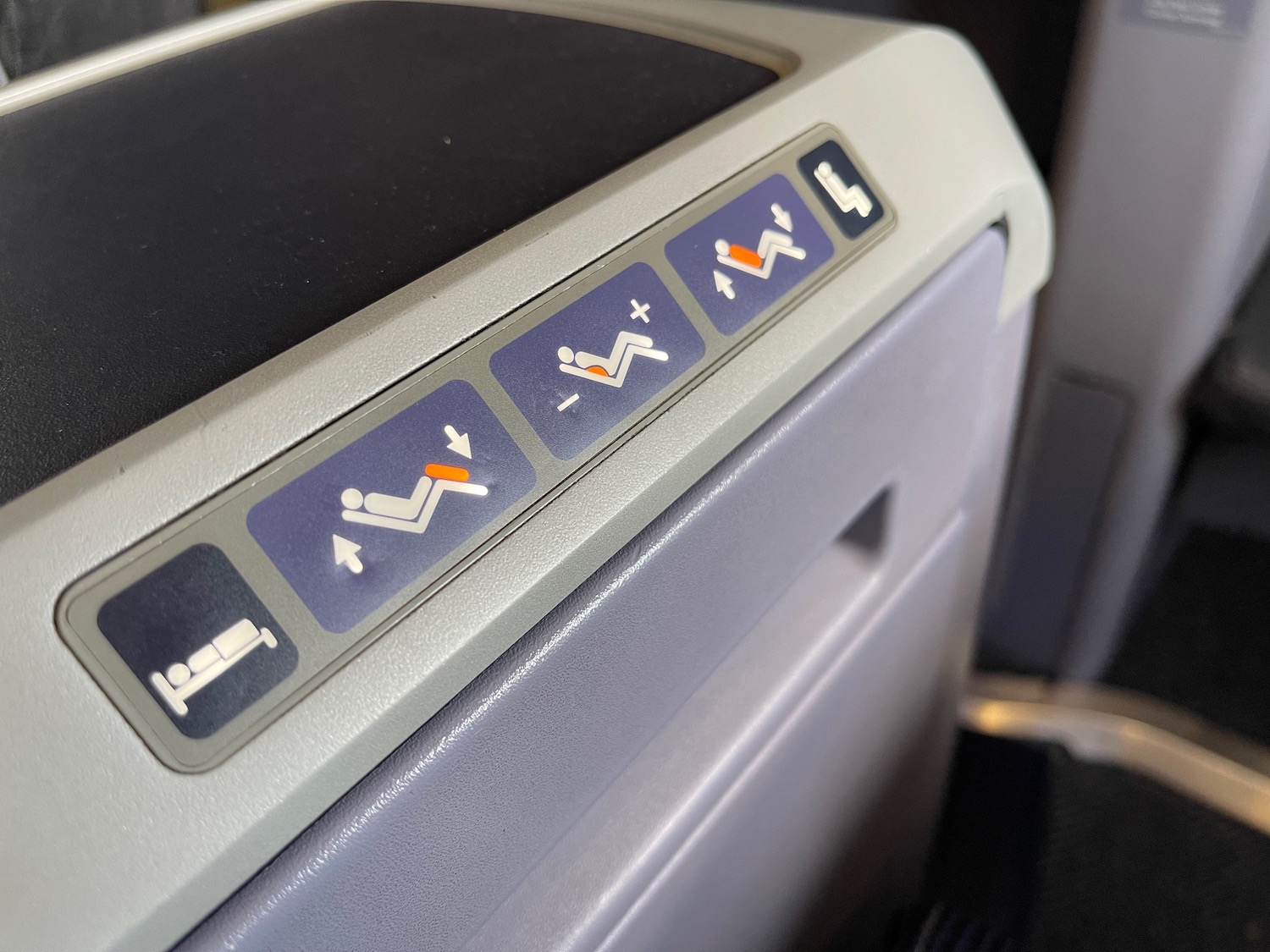 a seat belt with buttons and symbols