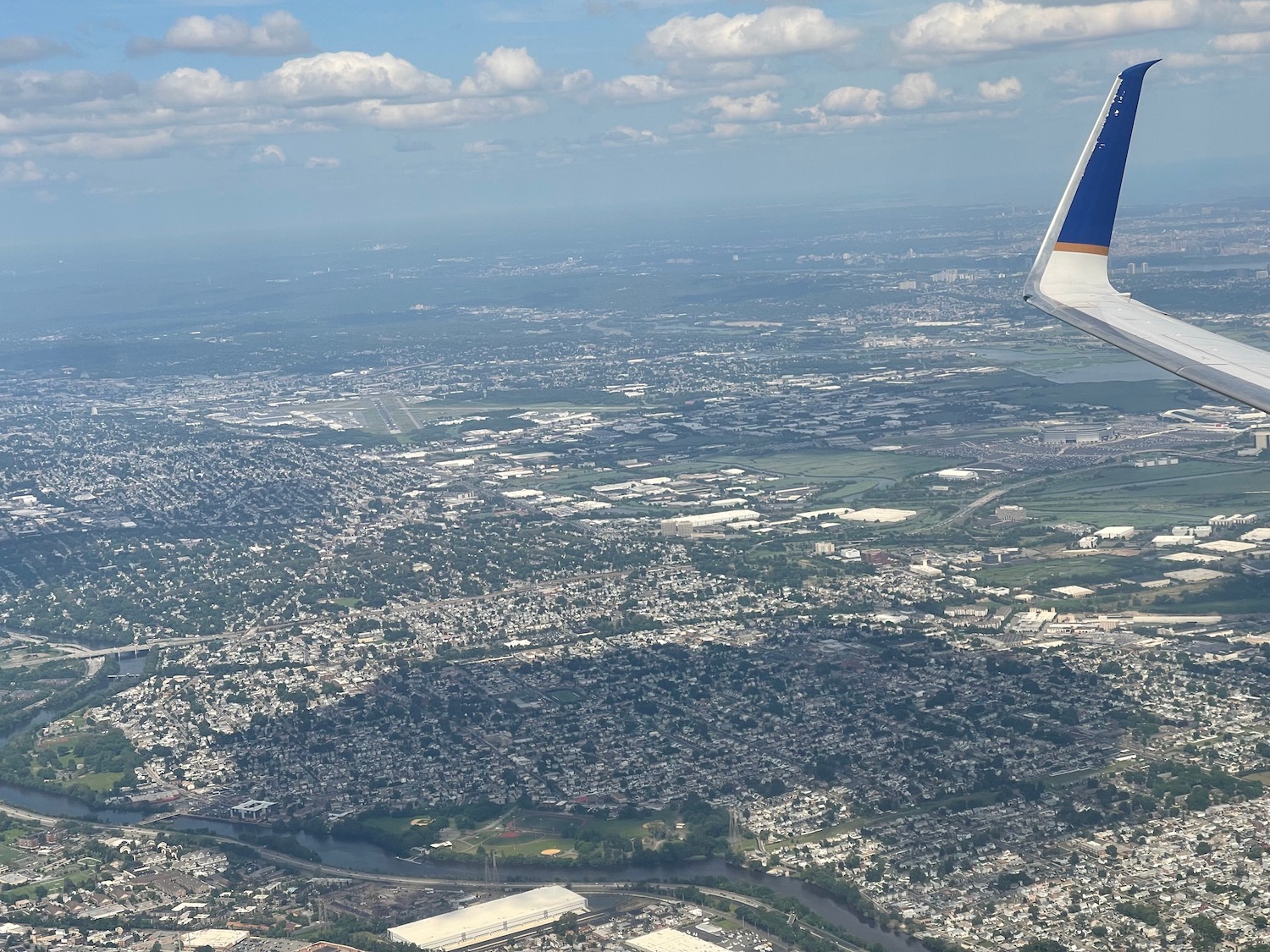 an airplane wing over a city