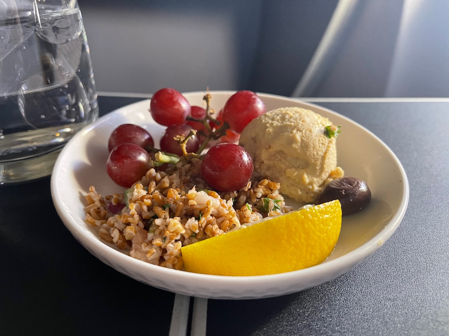 a bowl of food with fruit and ice cream