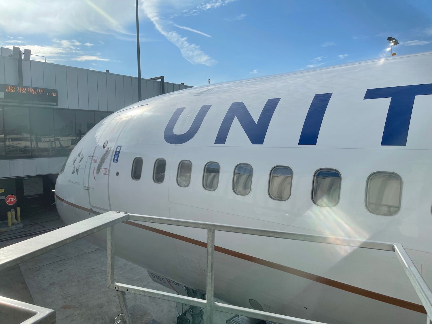 a white airplane with blue writing