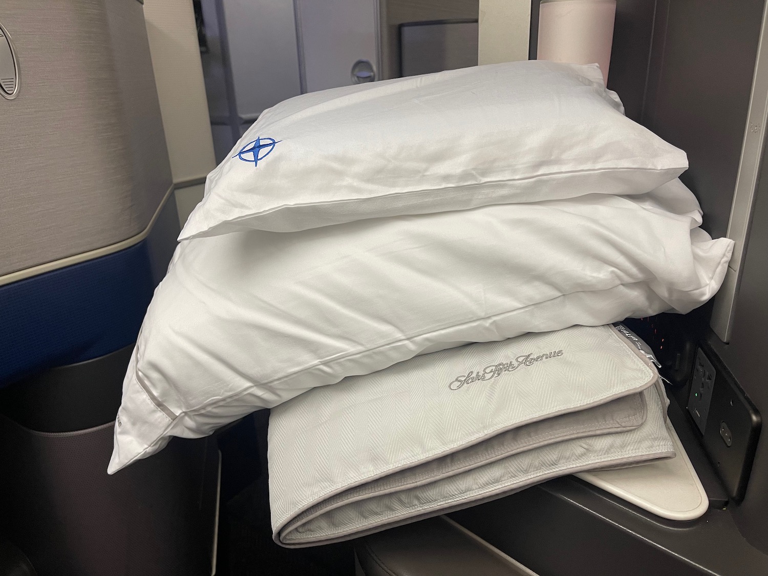 a stack of pillows on a plane