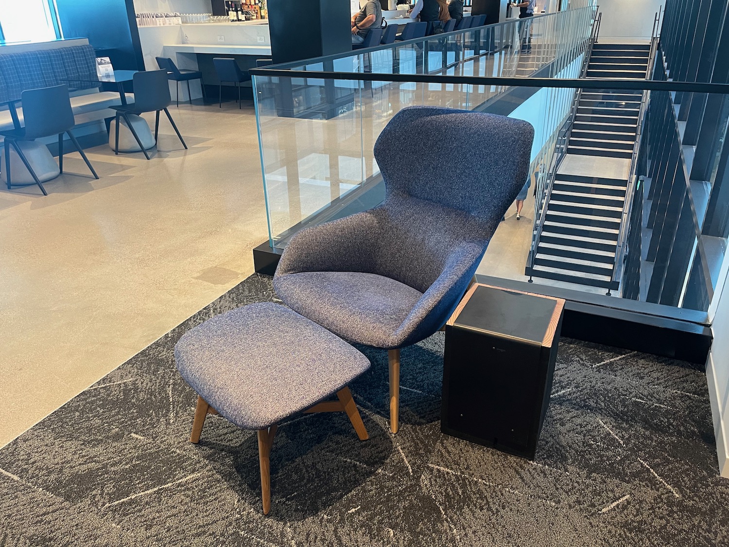 a chair and a stool in a room