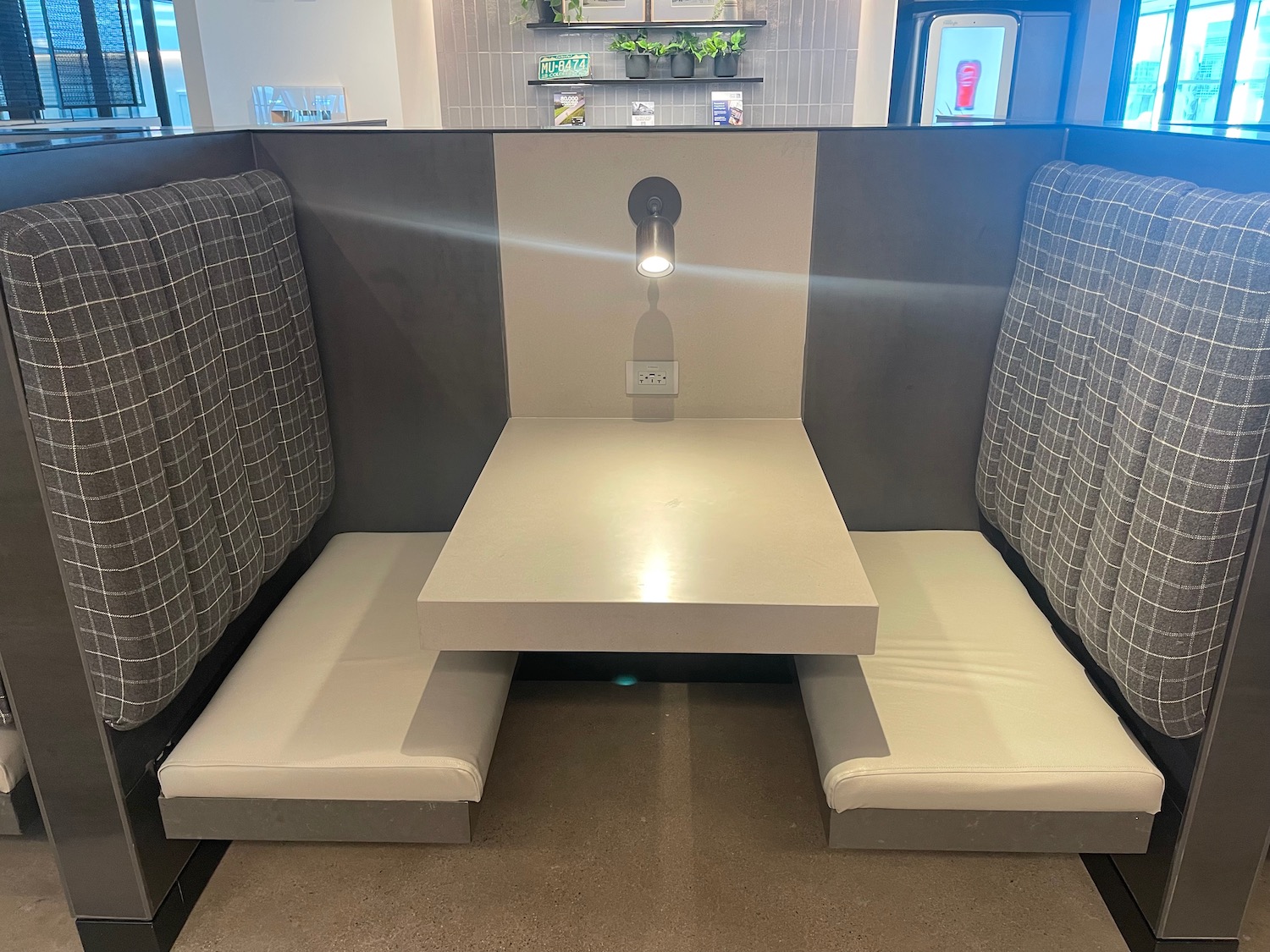 a booth with a table and two seats