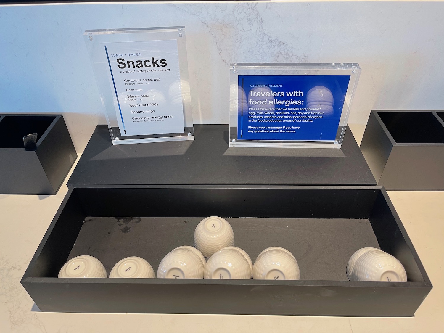 a group of white balls in a black box