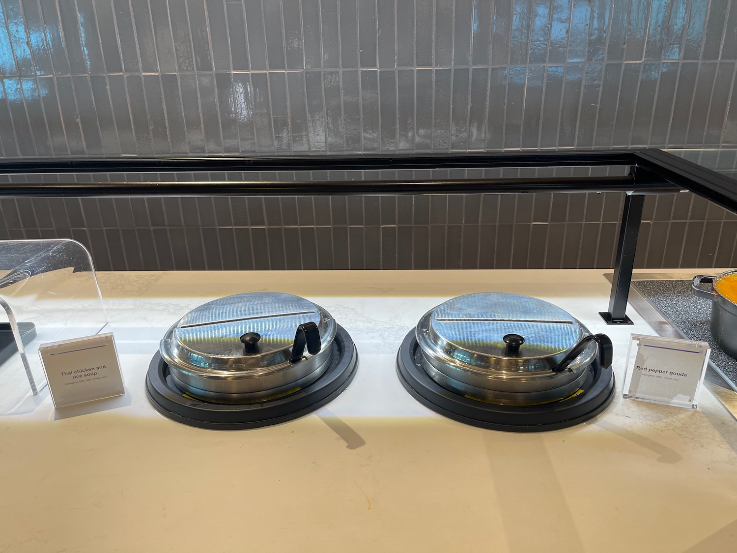 a group of metal containers on a counter