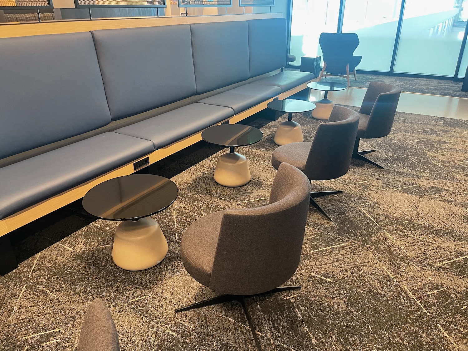 a group of chairs and tables in a room