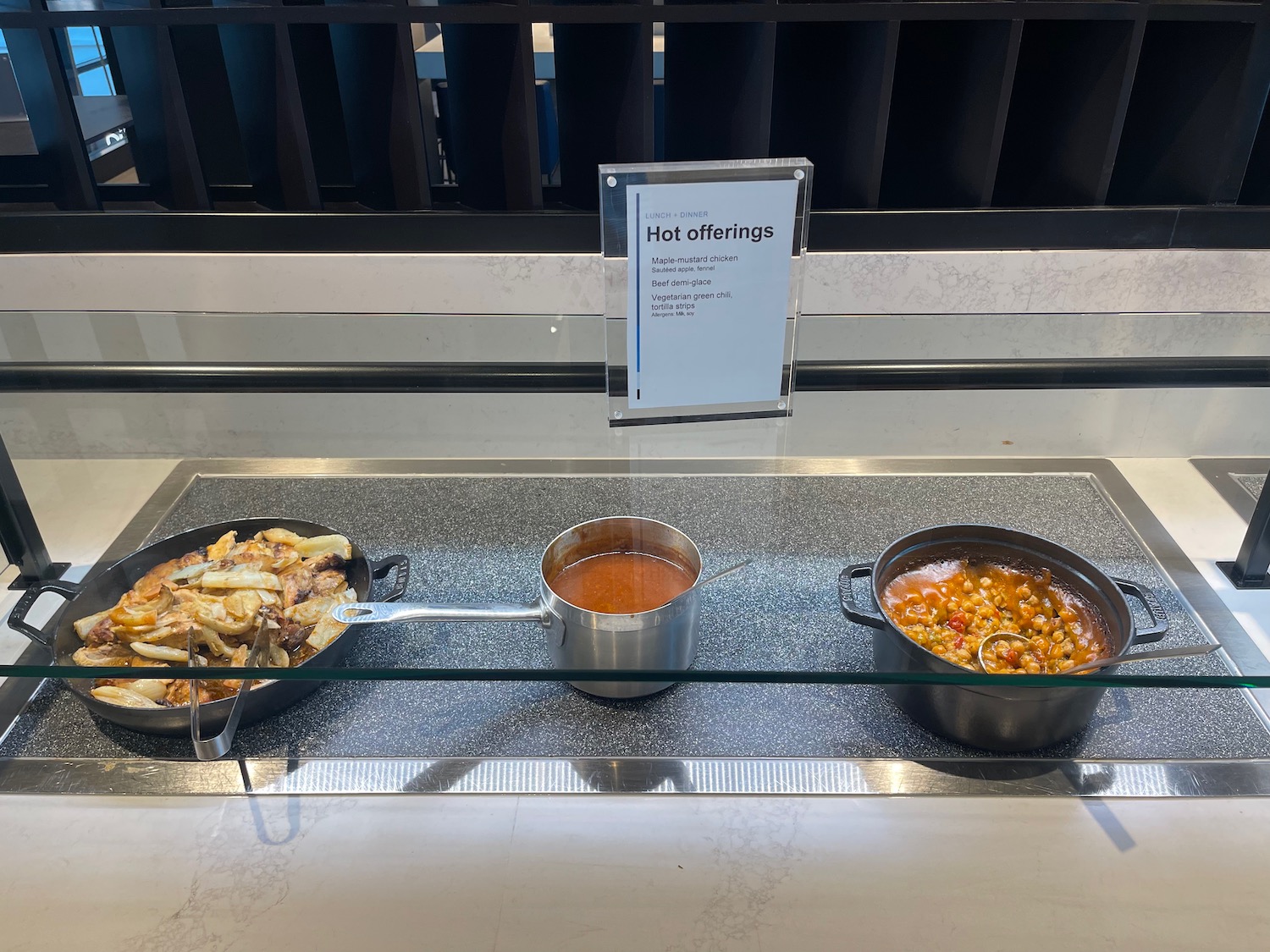 a pans and bowls of food on a counter