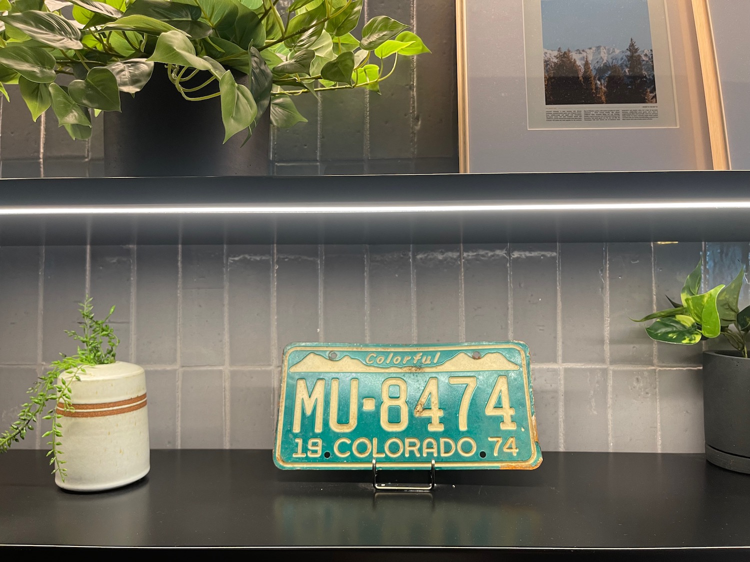 a license plate on a shelf