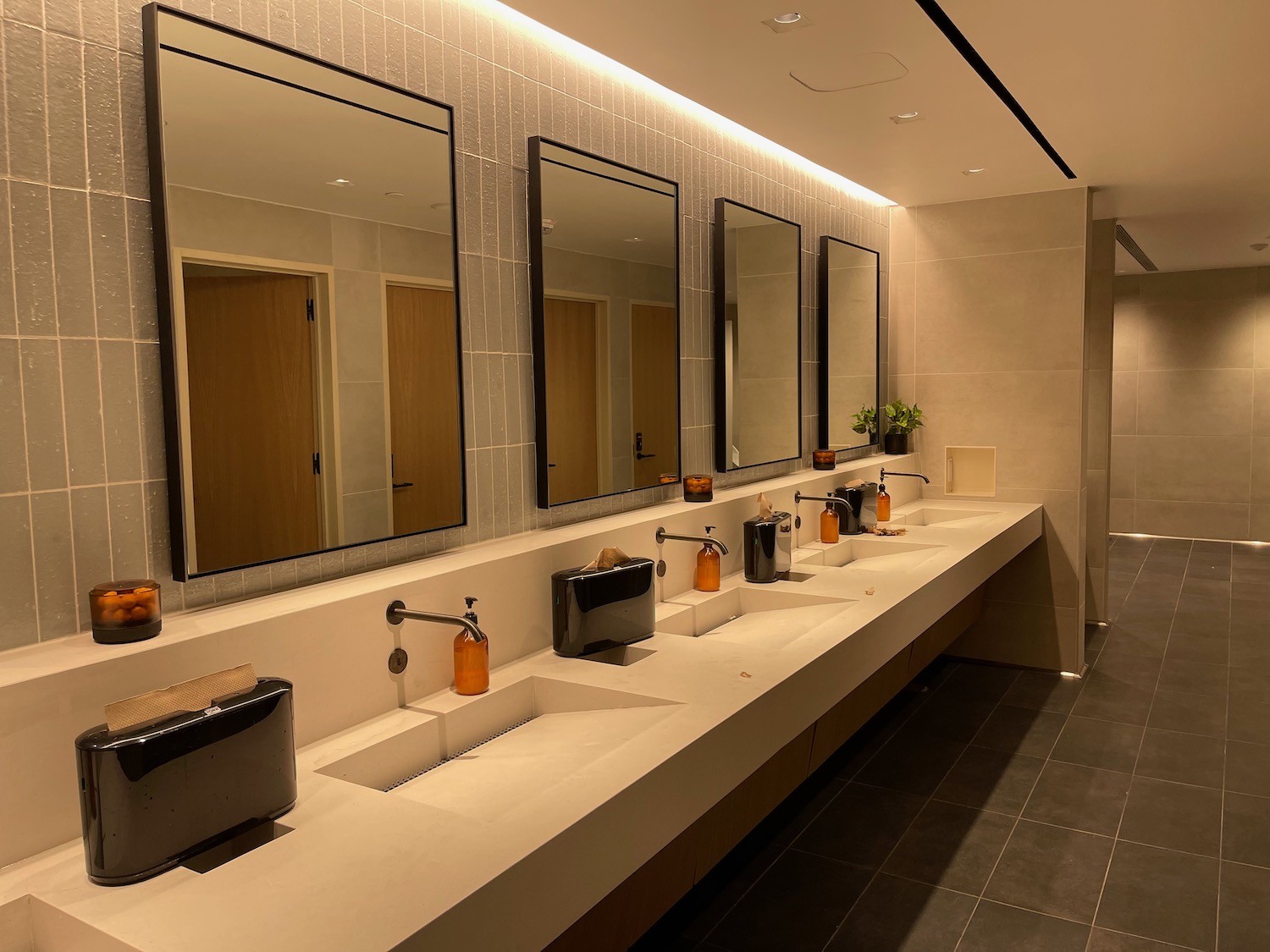 a bathroom with sinks and mirrors