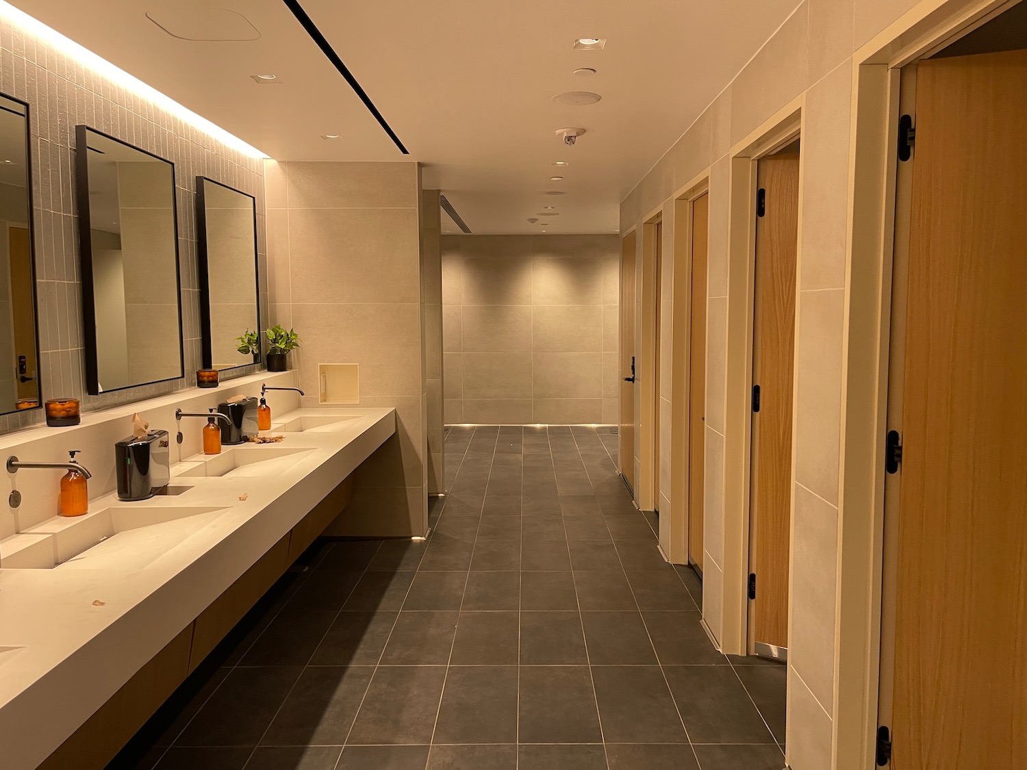 a bathroom with sinks and mirrors