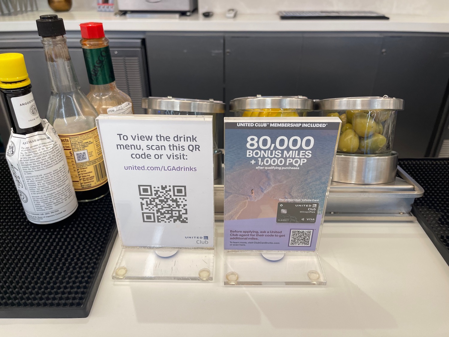 a bar counter with a bar and a bar sign