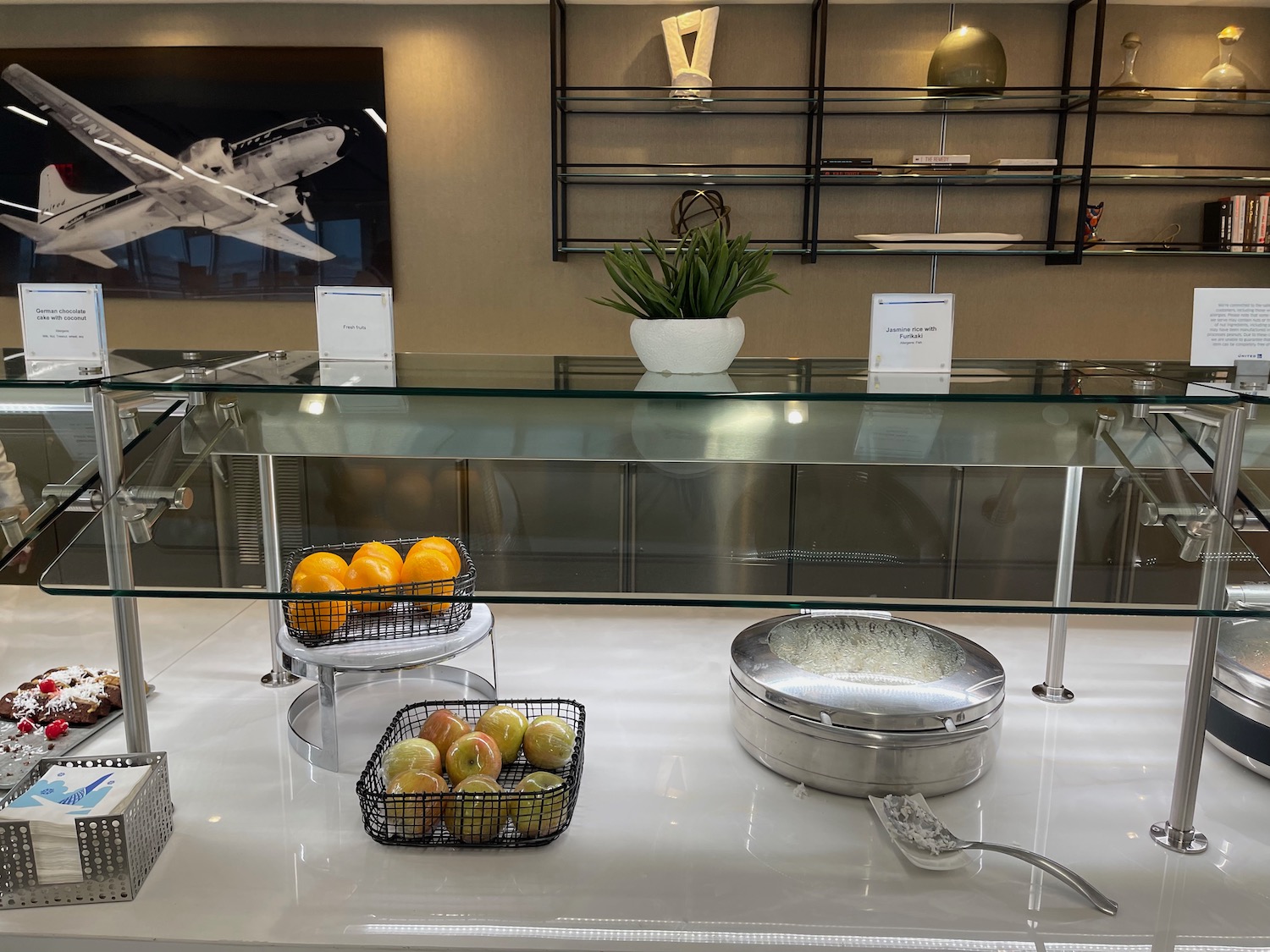 a glass counter with fruit on it